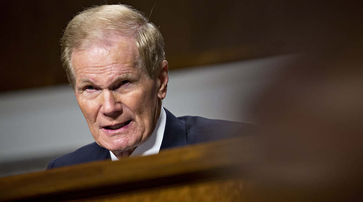 Bill Nelson With A Serious Expression Background