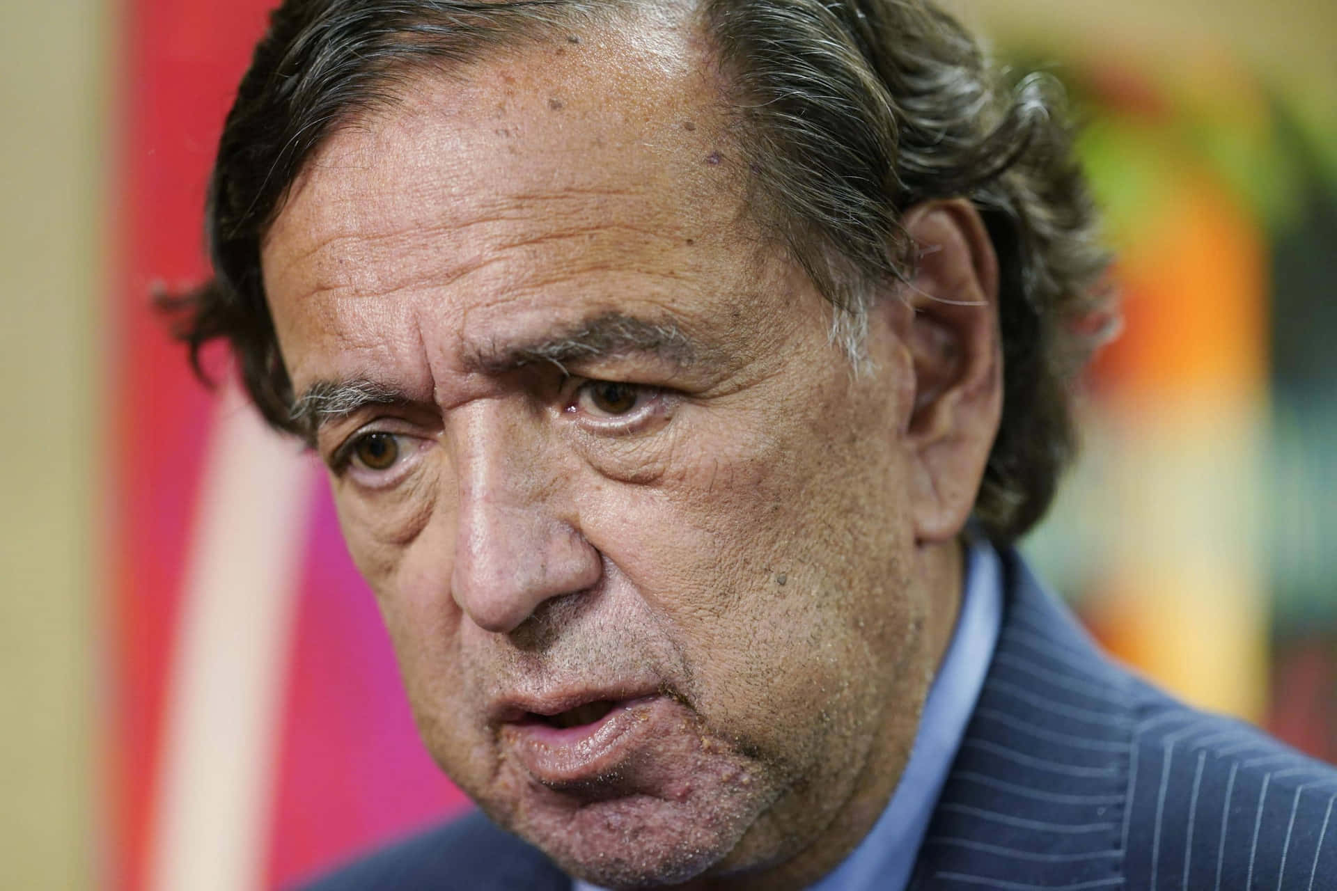 Bill Richardson Somber Expression Background