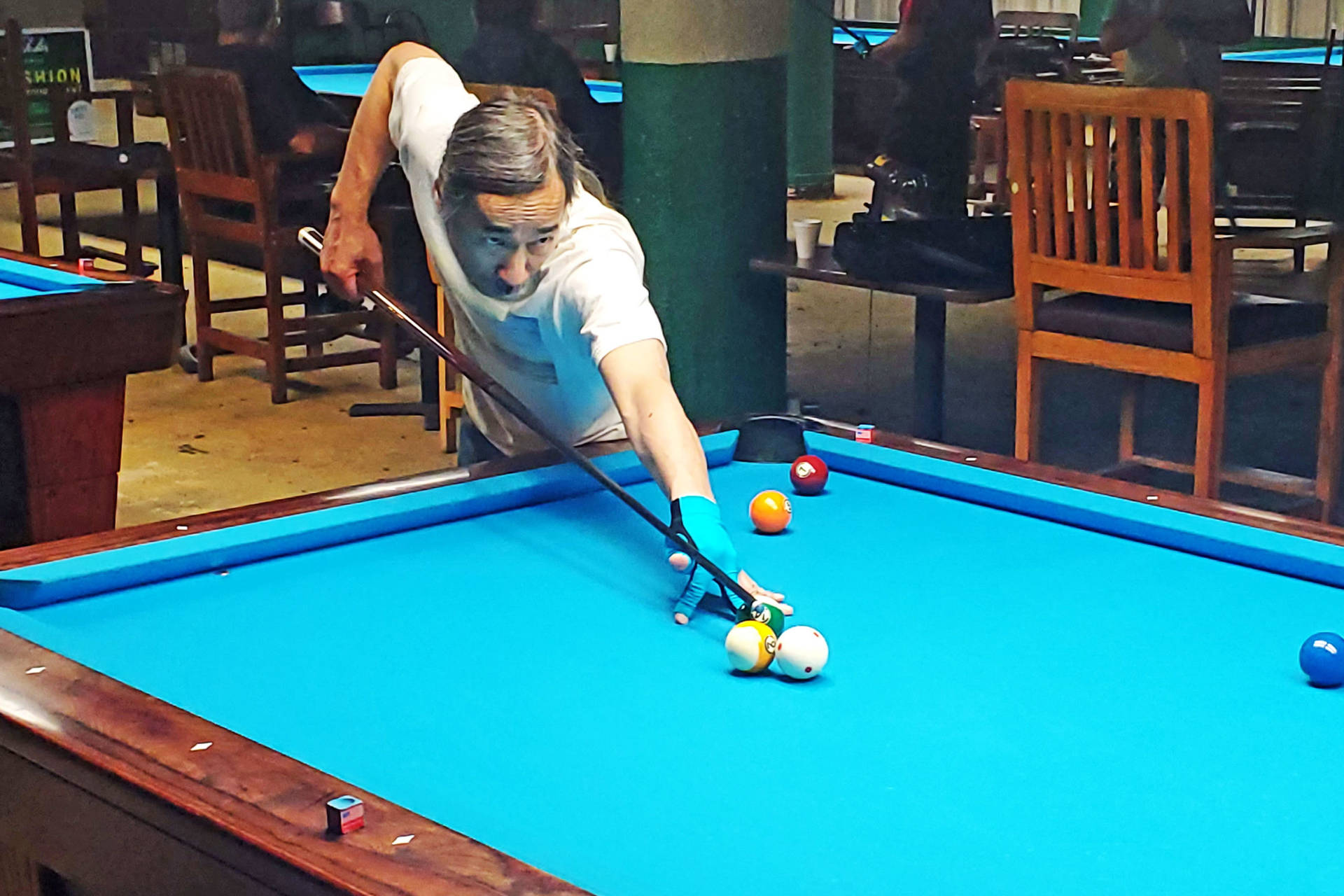 Billiards Man Playing Blue Pool Table At Bar Background