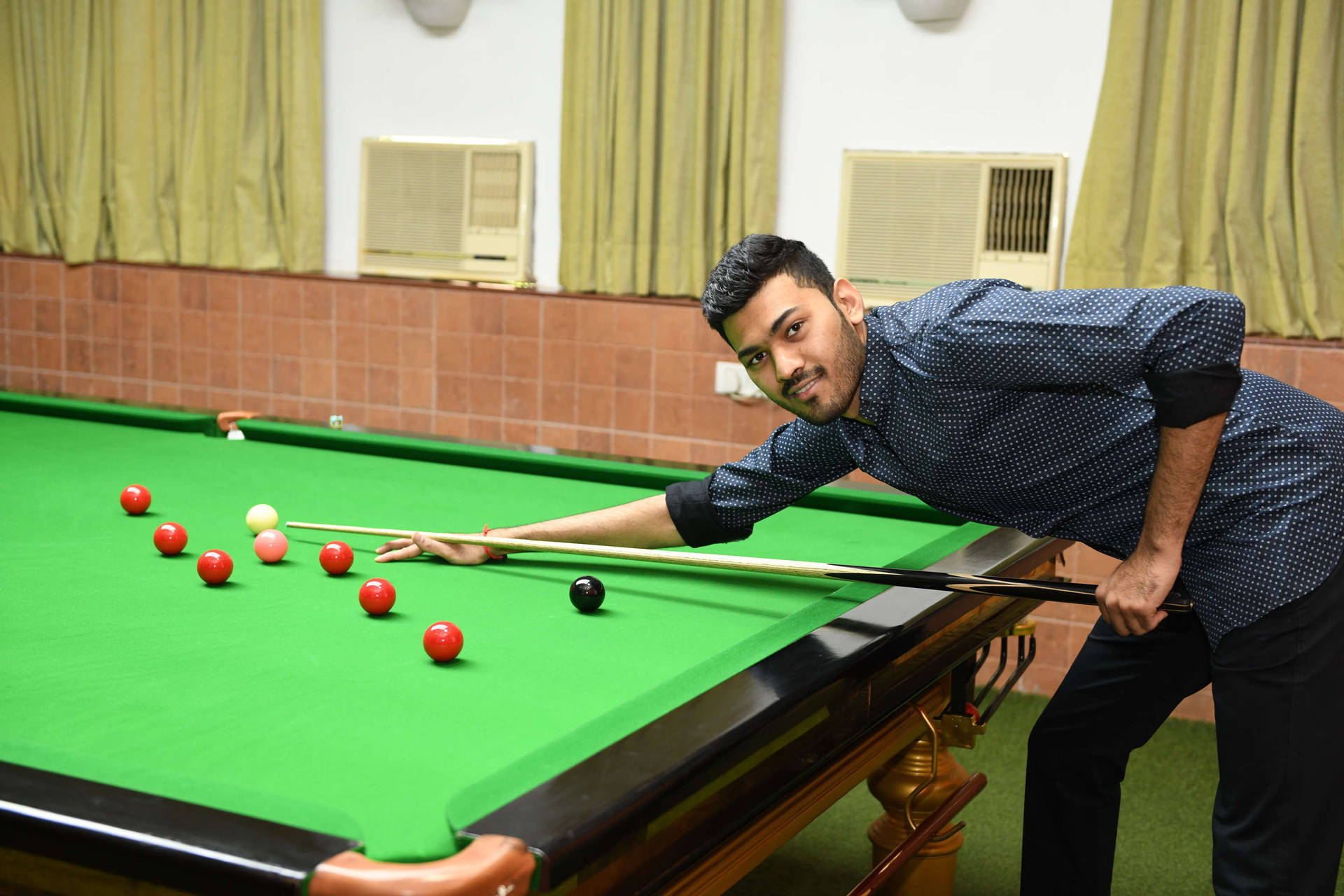 Billiards Man With Pool Stick On Pool Table Background