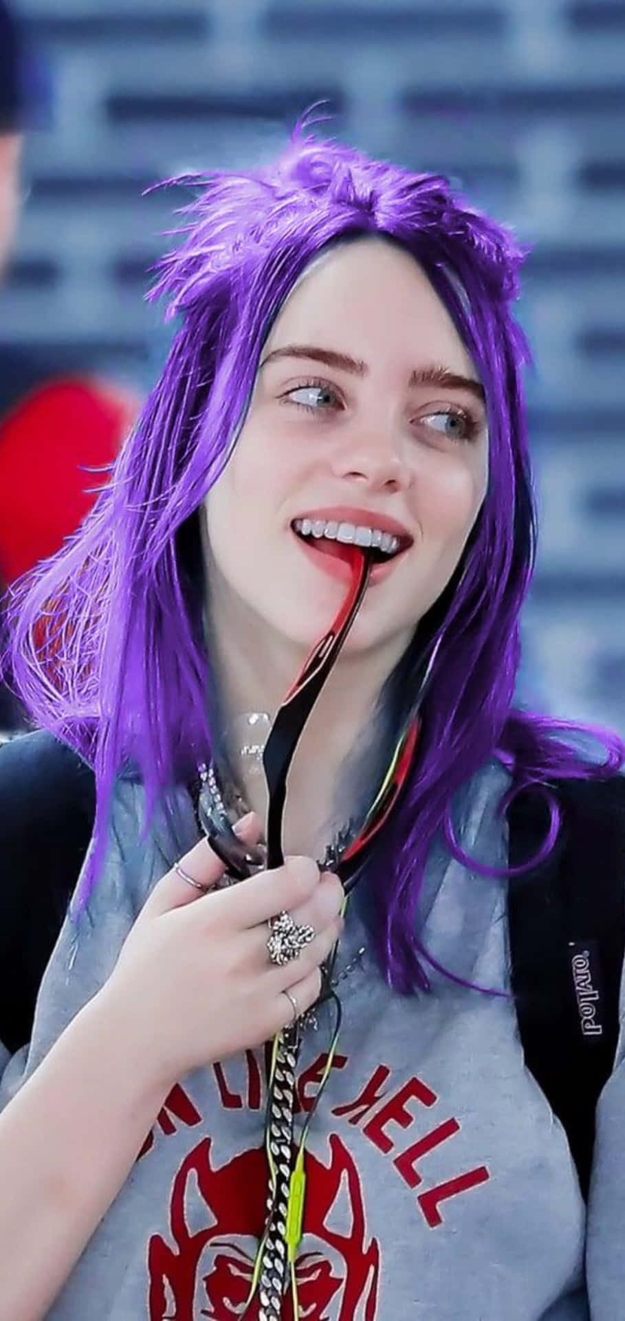 Billie Eilish In A Swathe Of Purple Background