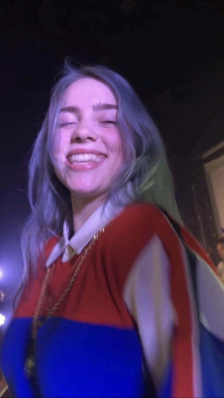 Billie Eilish Is Ready To Share Her Signature Smile Background