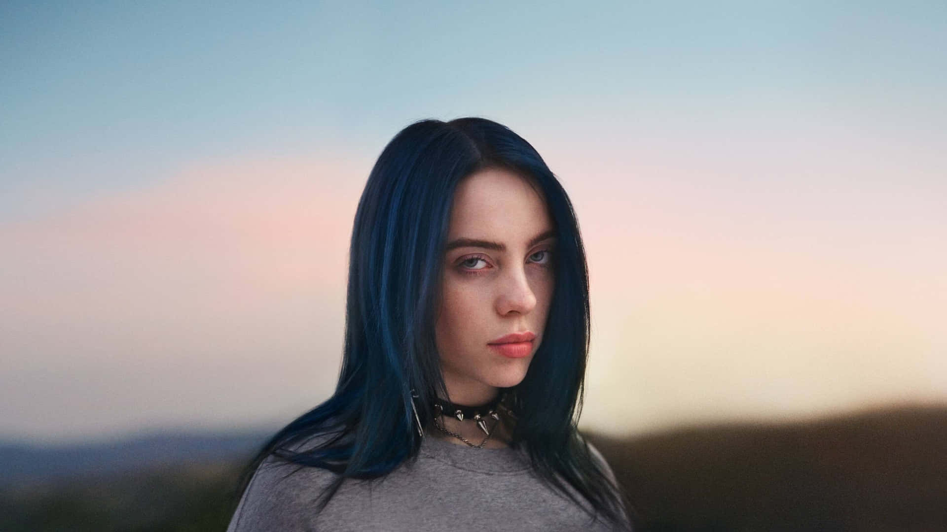 Billie Eilish On Her Laptop Background