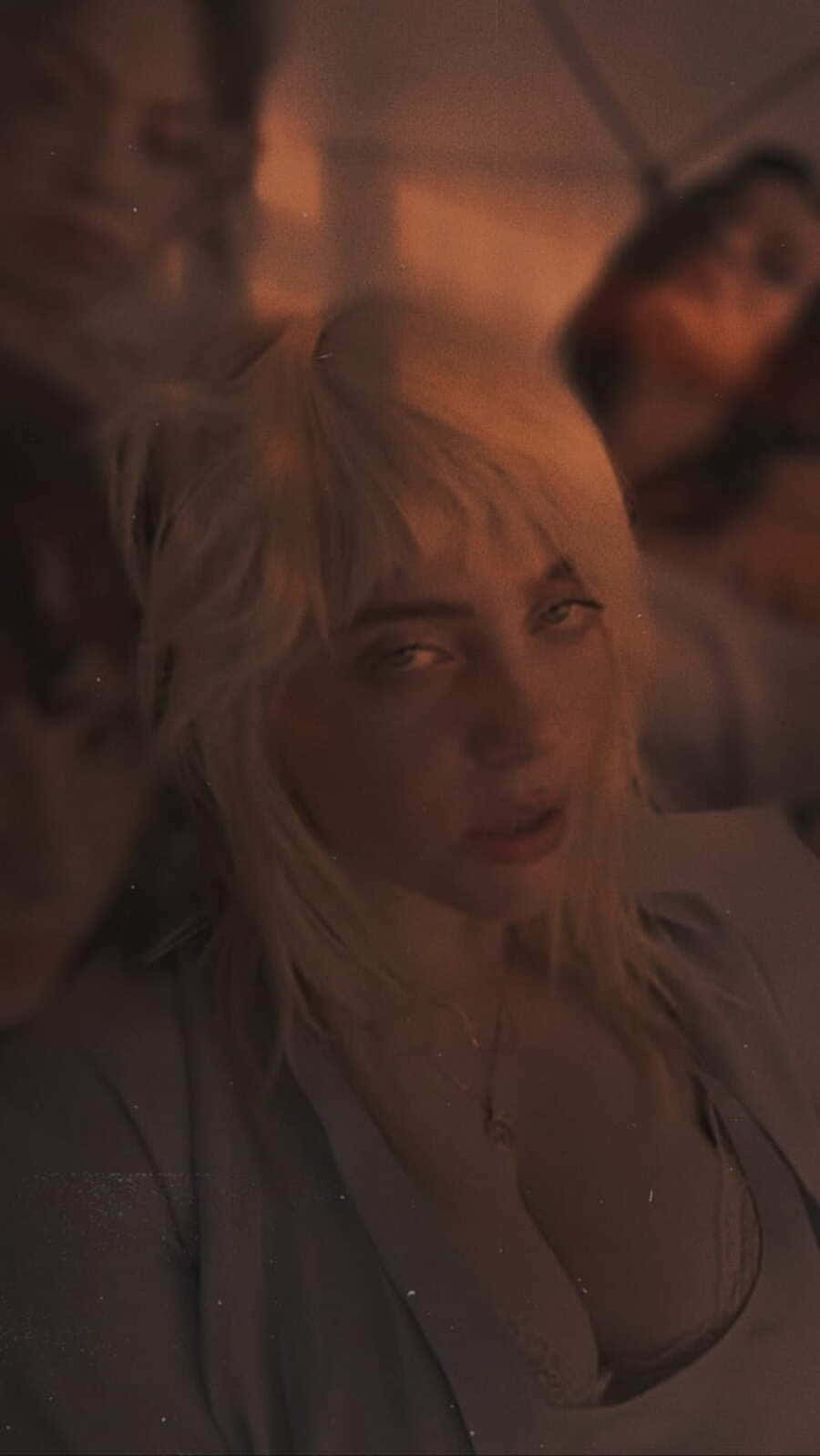Billie Eilish Somber Expression Background