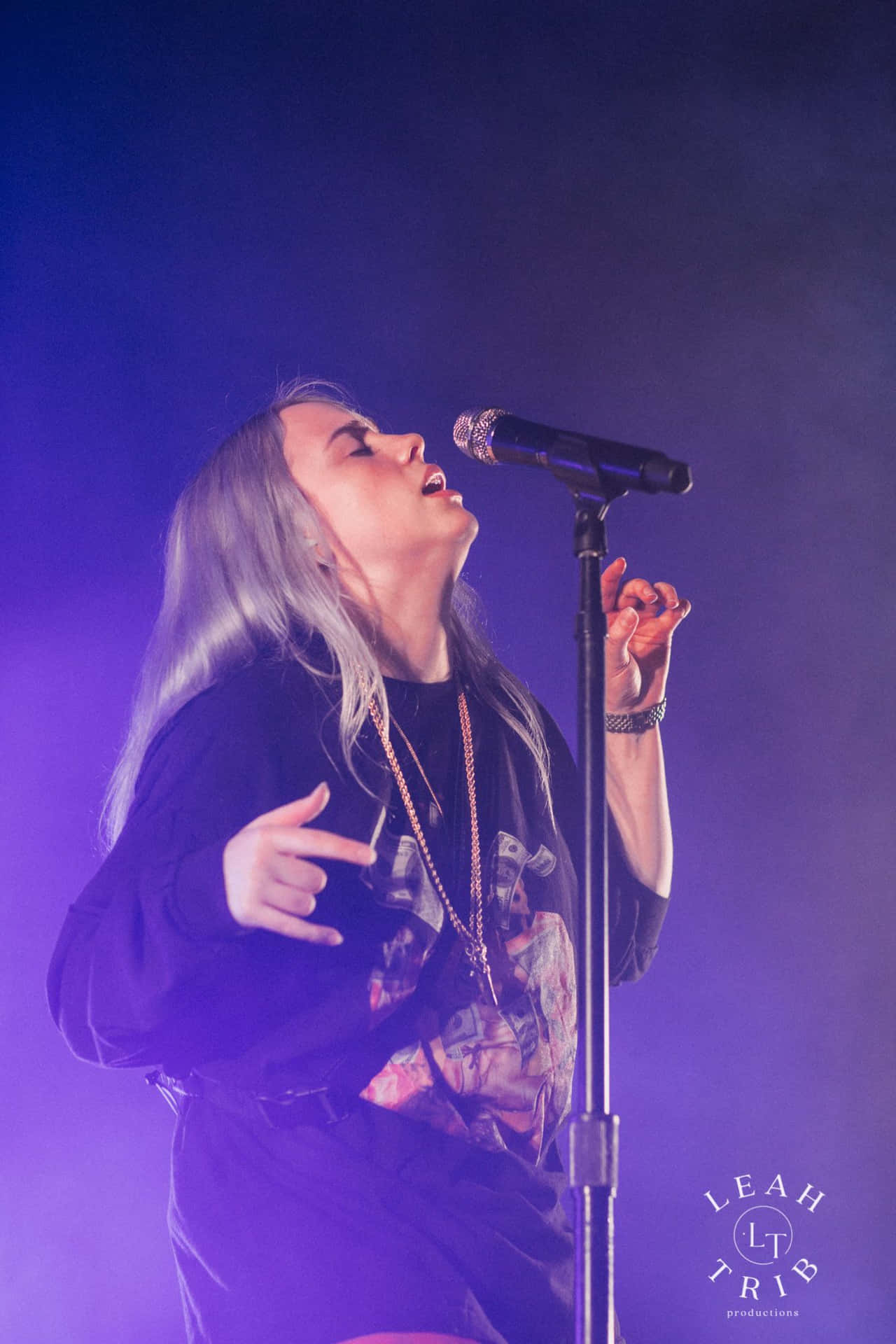 Billie Eilish Walks Through A Purple Wonderland Background