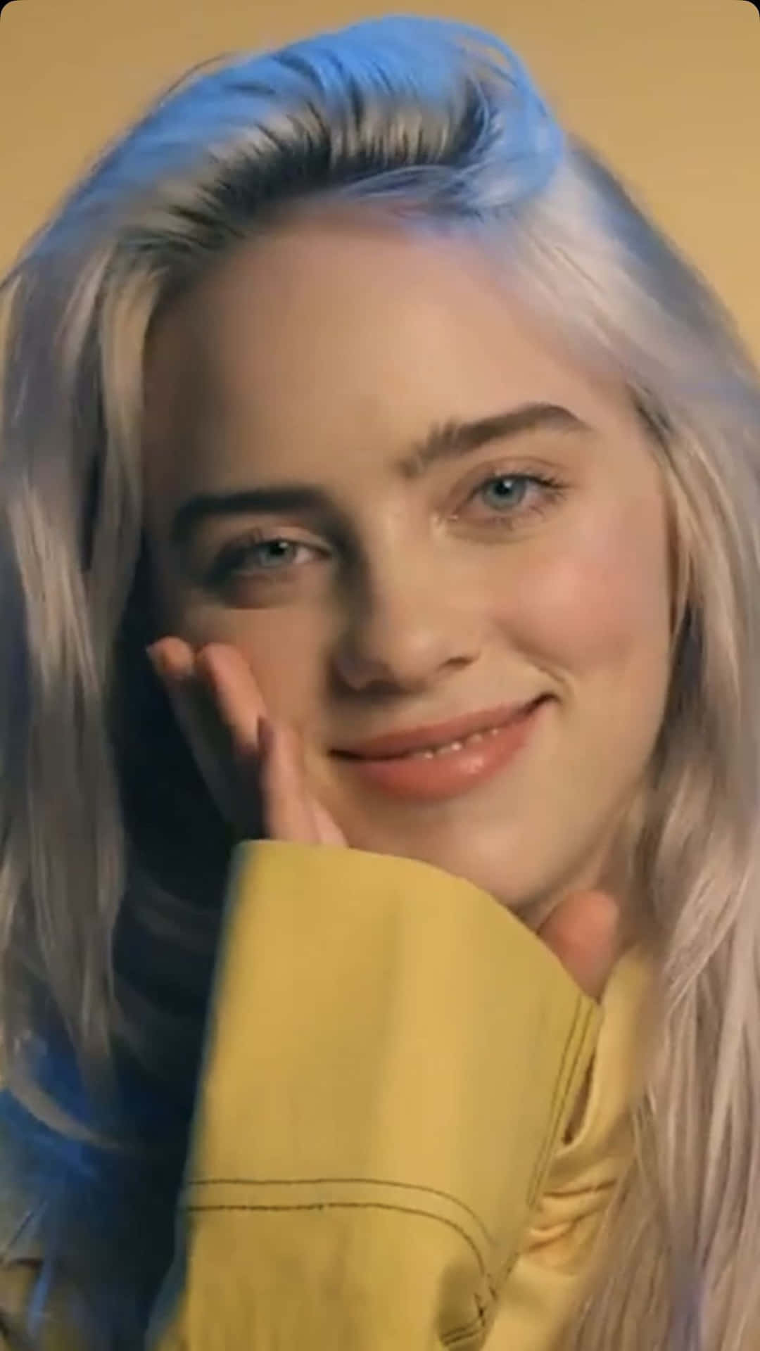Billie Eilish With A Smile On Her Face Background