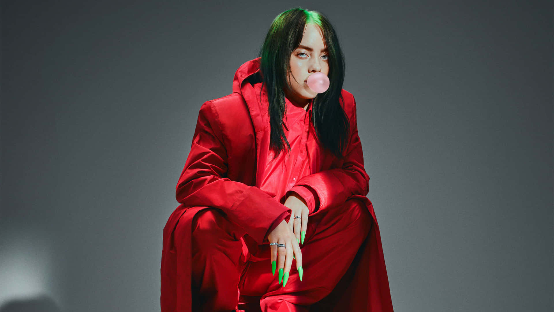 Billie Eilish Working On Her Laptop Background