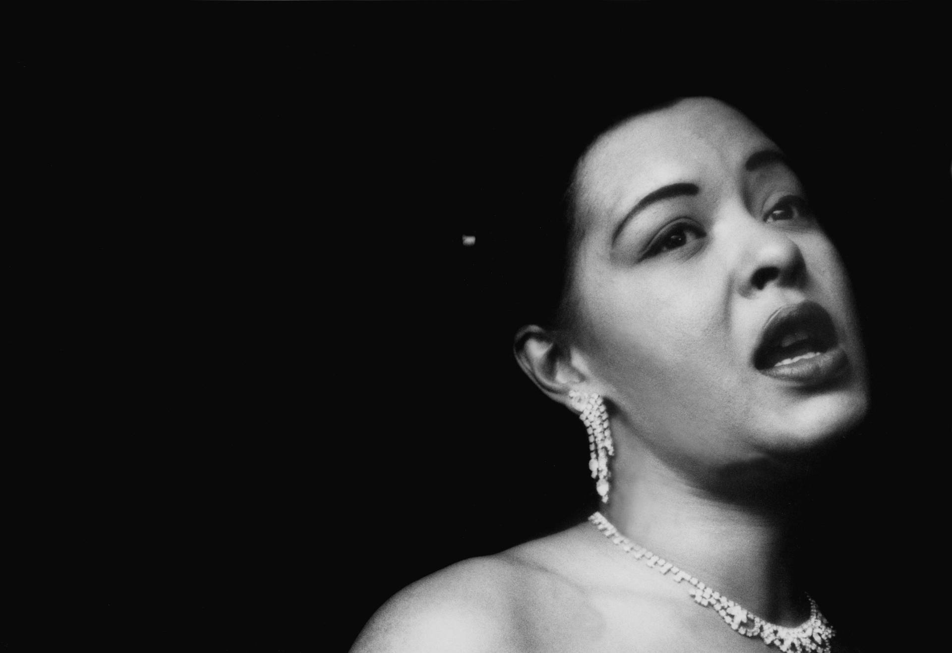 Billie Holiday Wearing Jewelry Background