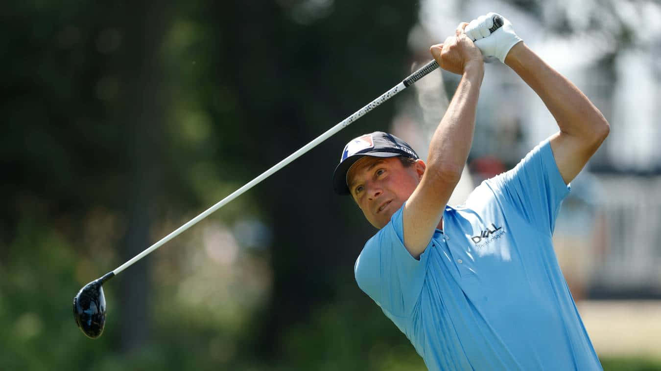 Billy Andrade Wearing A Light Blue Polo Shirt Background
