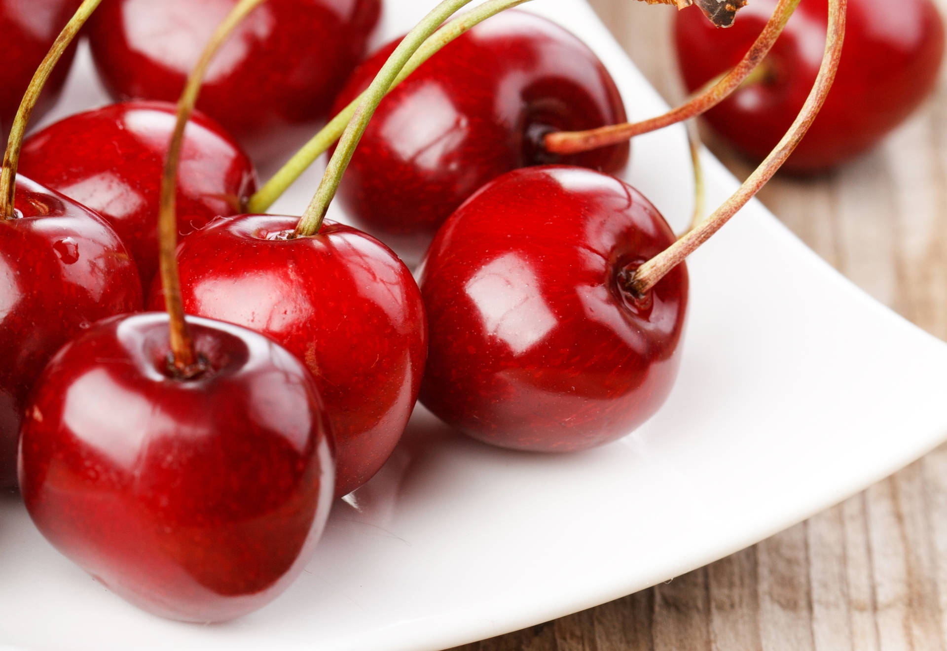 Bing Cherries On A Plate Background
