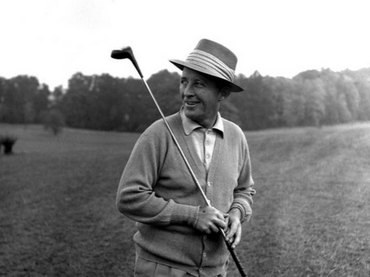 Bing Crosby Holding A Golf Stick Background