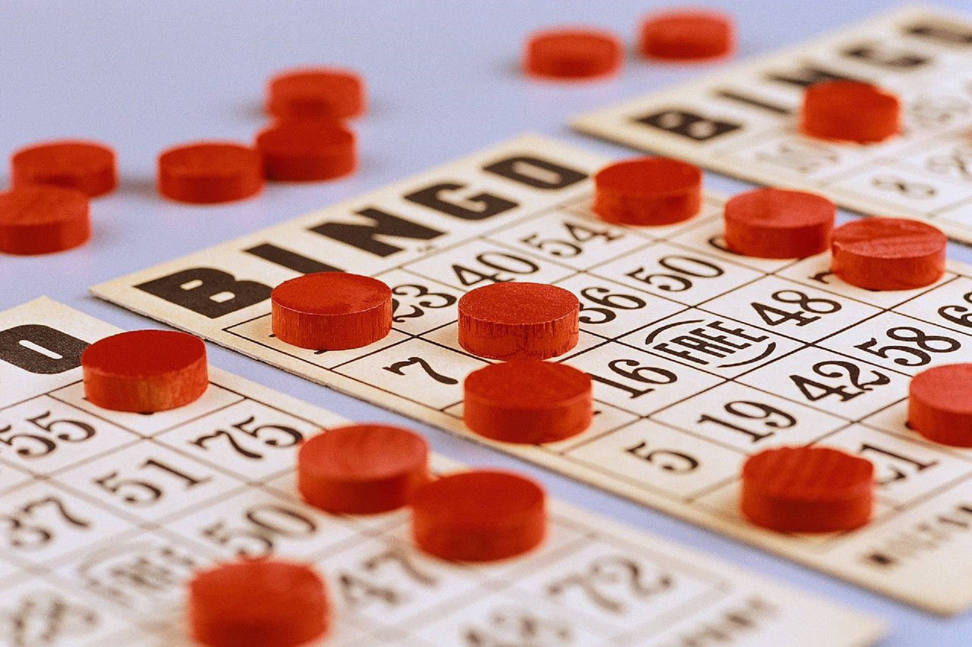 Bingo Cards And Red Pins Background