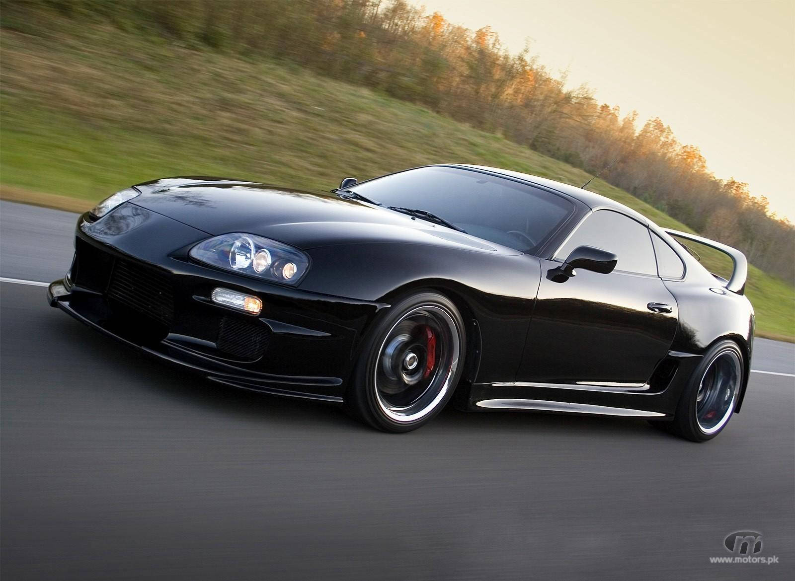 Black 1998 Toyota Supra Mk4 On The Road Background