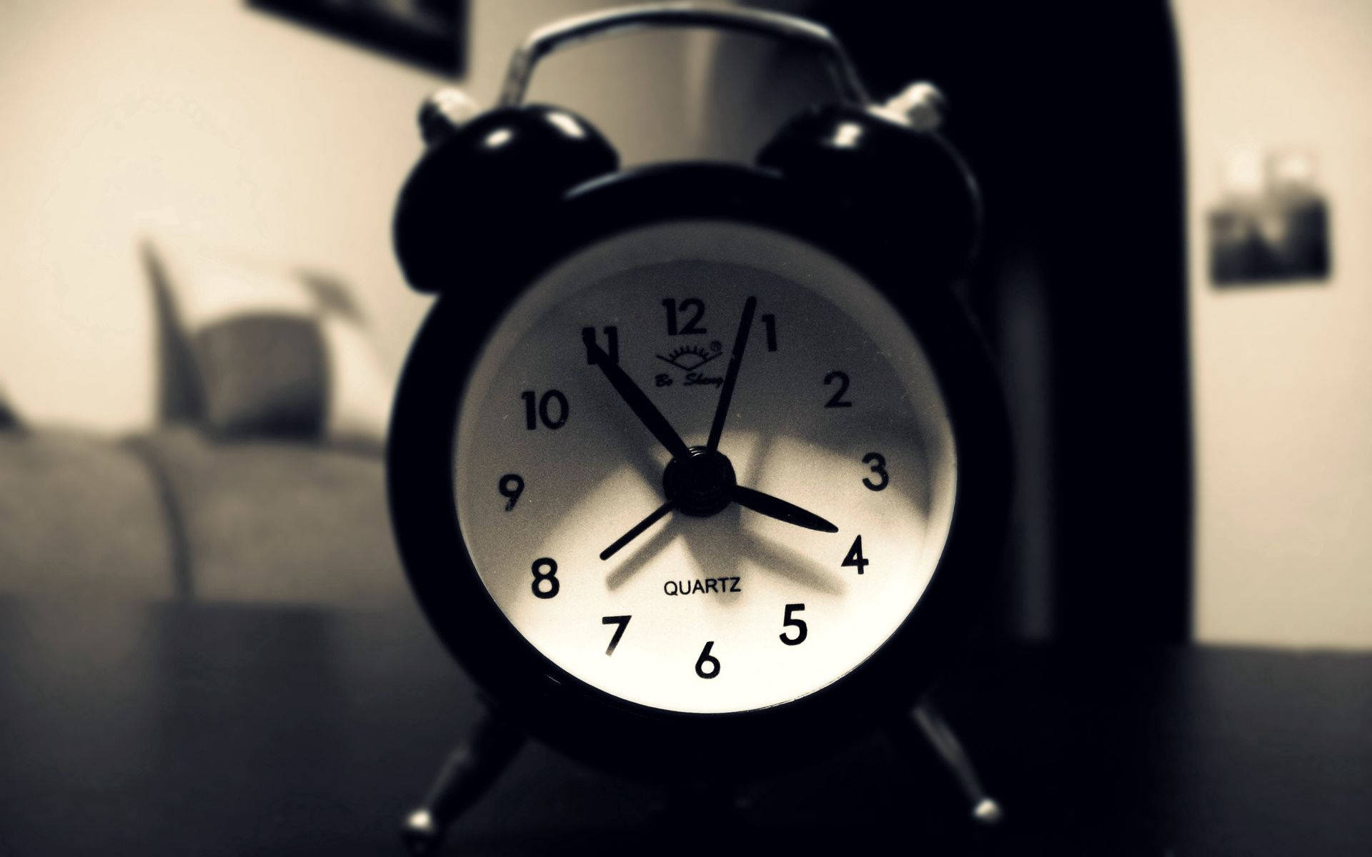 Black Alarm Clock On Desk
