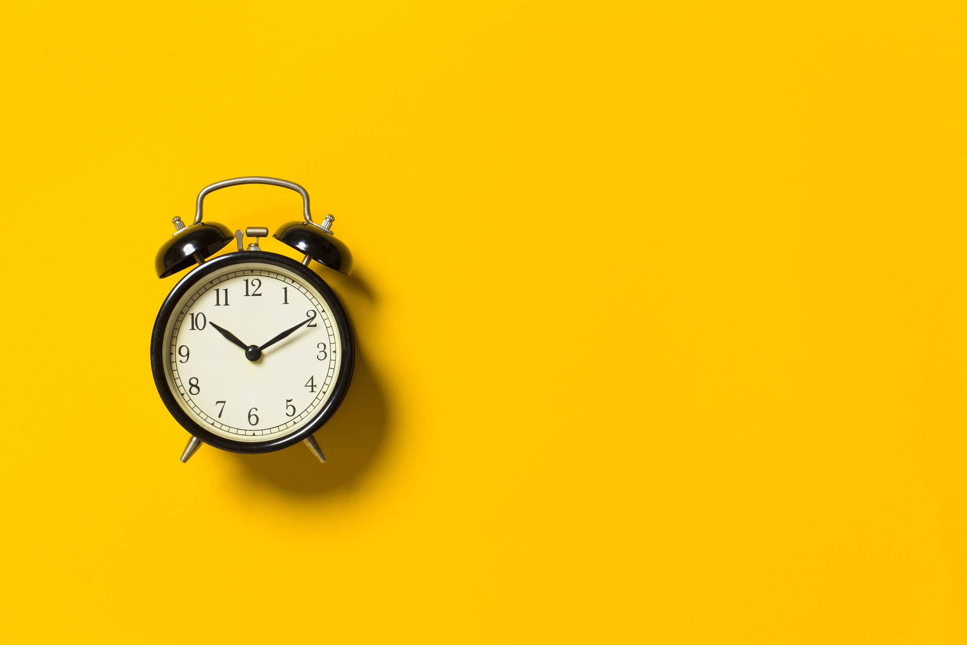 Black Alarm Clock Yellow Background