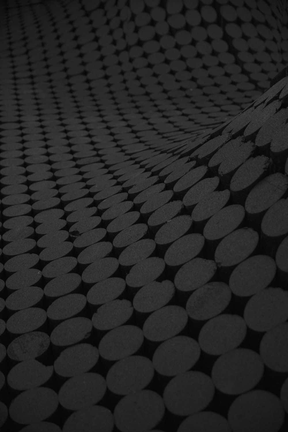 Black And Gray Carpet With A Circle Pattern Design Background