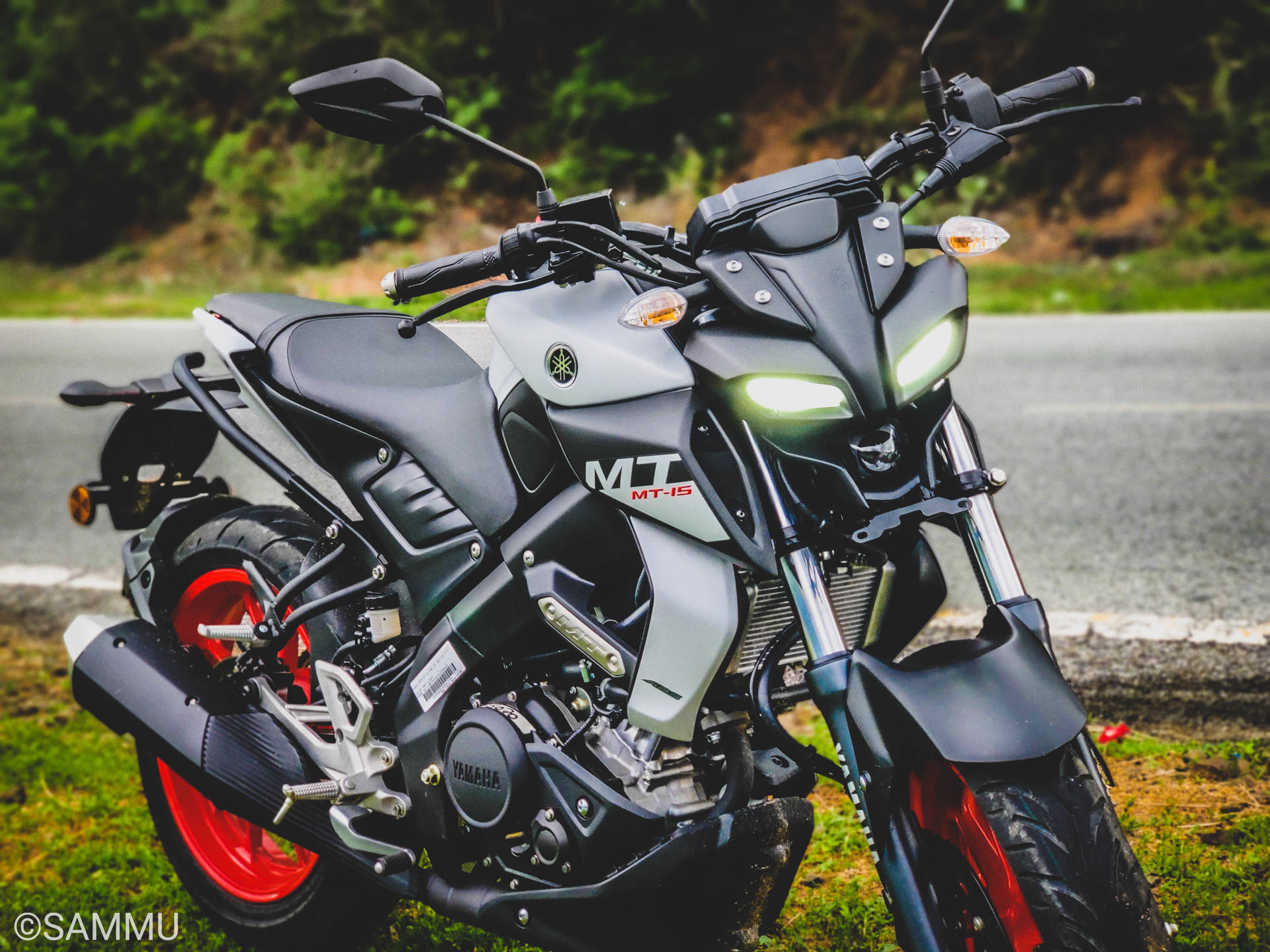 Black And Grey Yamaha Mt 15 With Red Rims Background