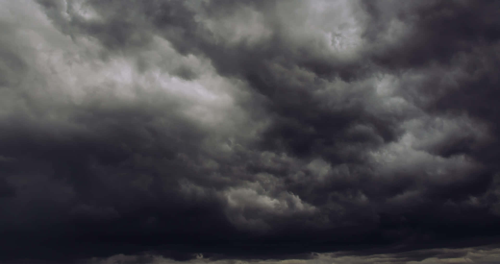 Black And White Clouds Intersecting In The Sky Background