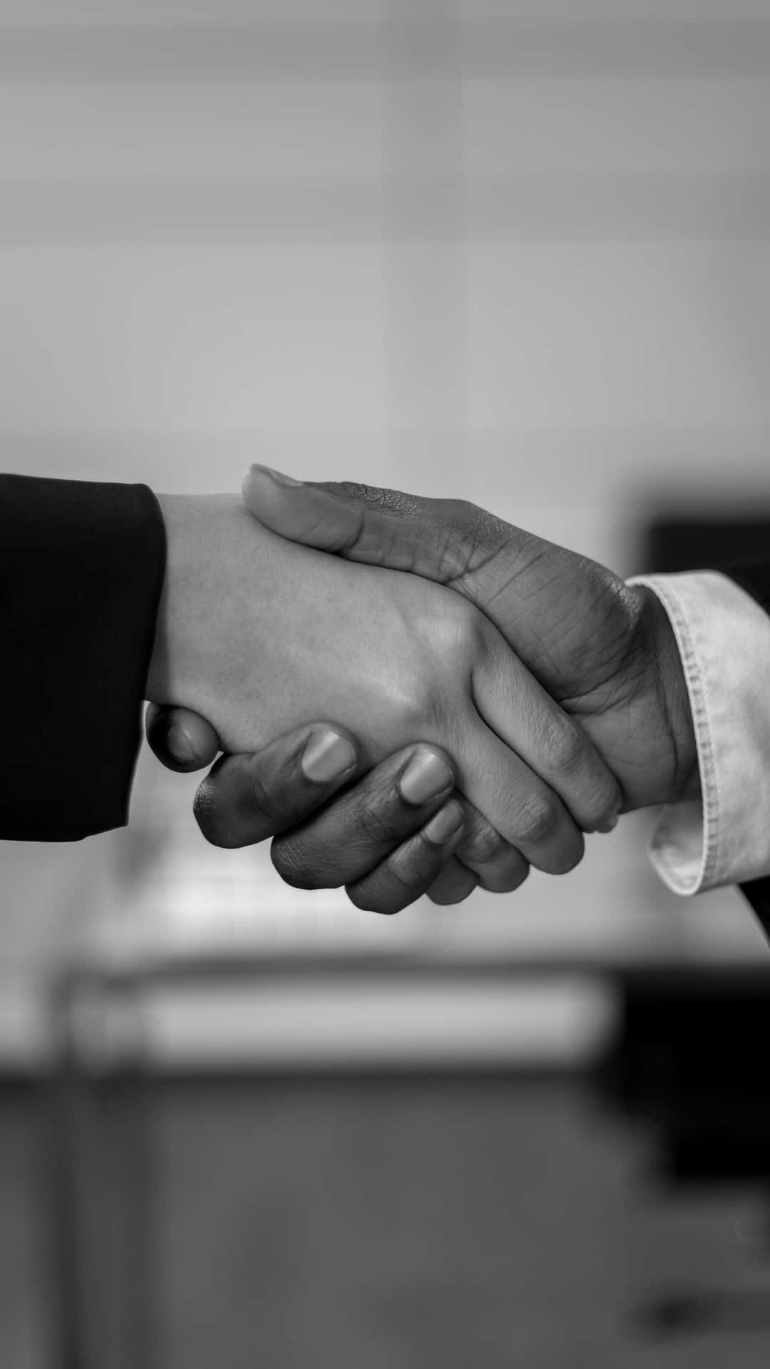 Black And White Firm Handshake Background