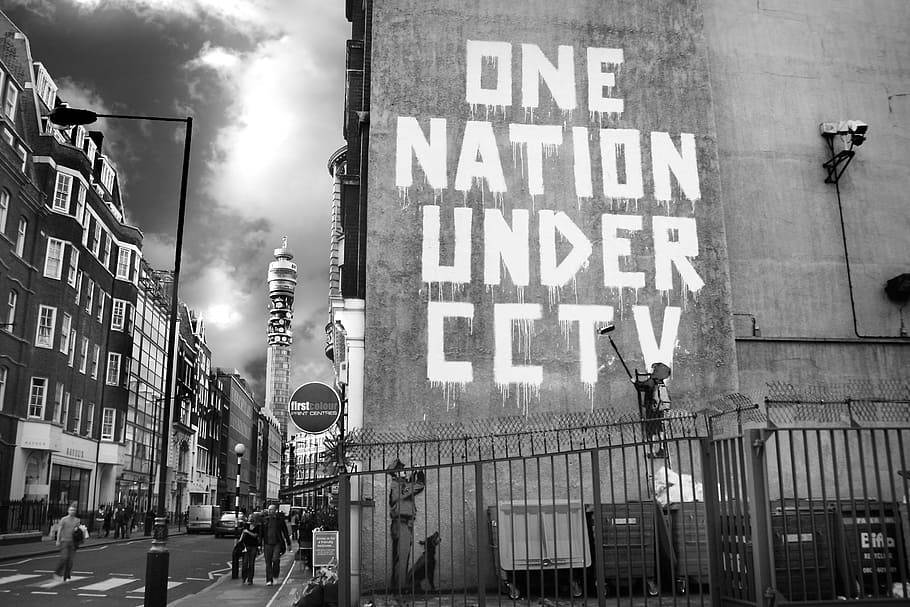 Black And White Graffiti One Nation Under Cctv Background