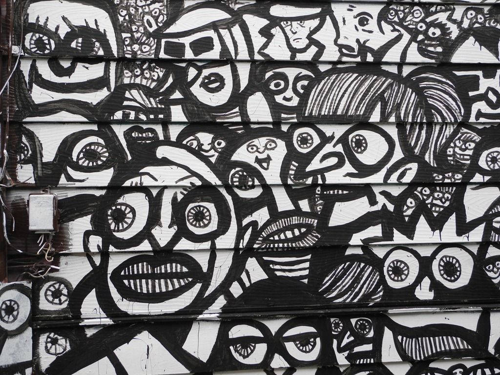 Black And White Graffiti People With Bulging Eyes Background