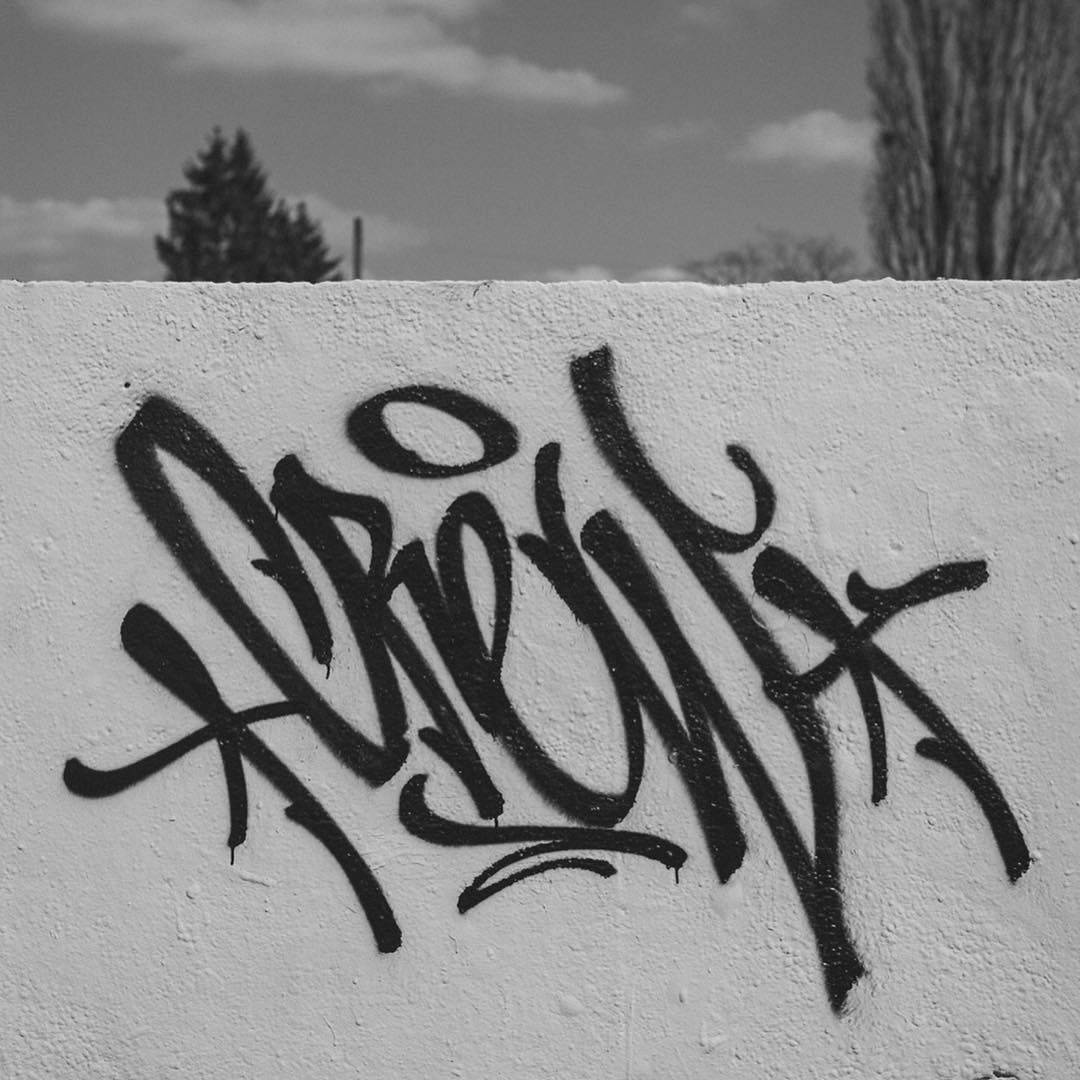 Black And White Graffiti Tag On A Wall Fence Background