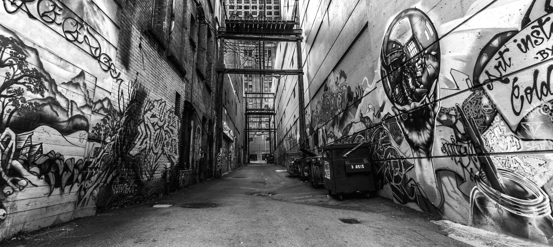 Black And White Graffiti Walls And A Linear Road