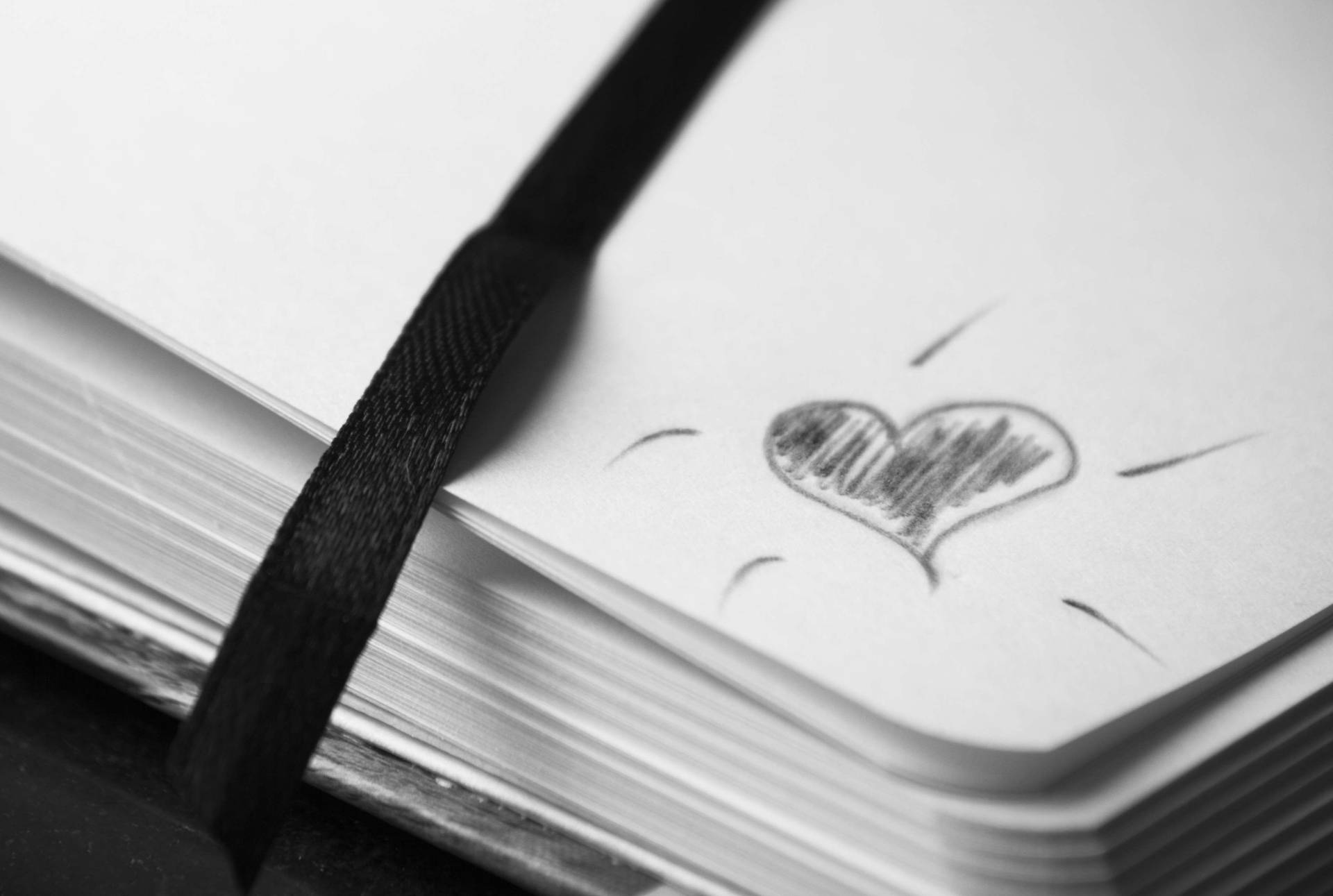 Black And White Heart On Journal Background