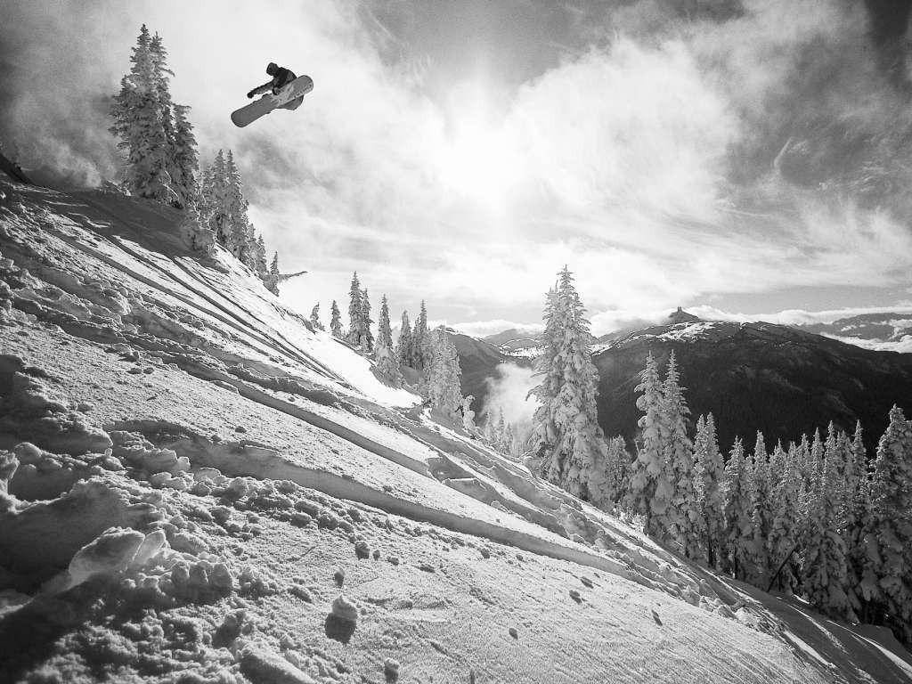 Black And White Man With Snowboard Down Slope