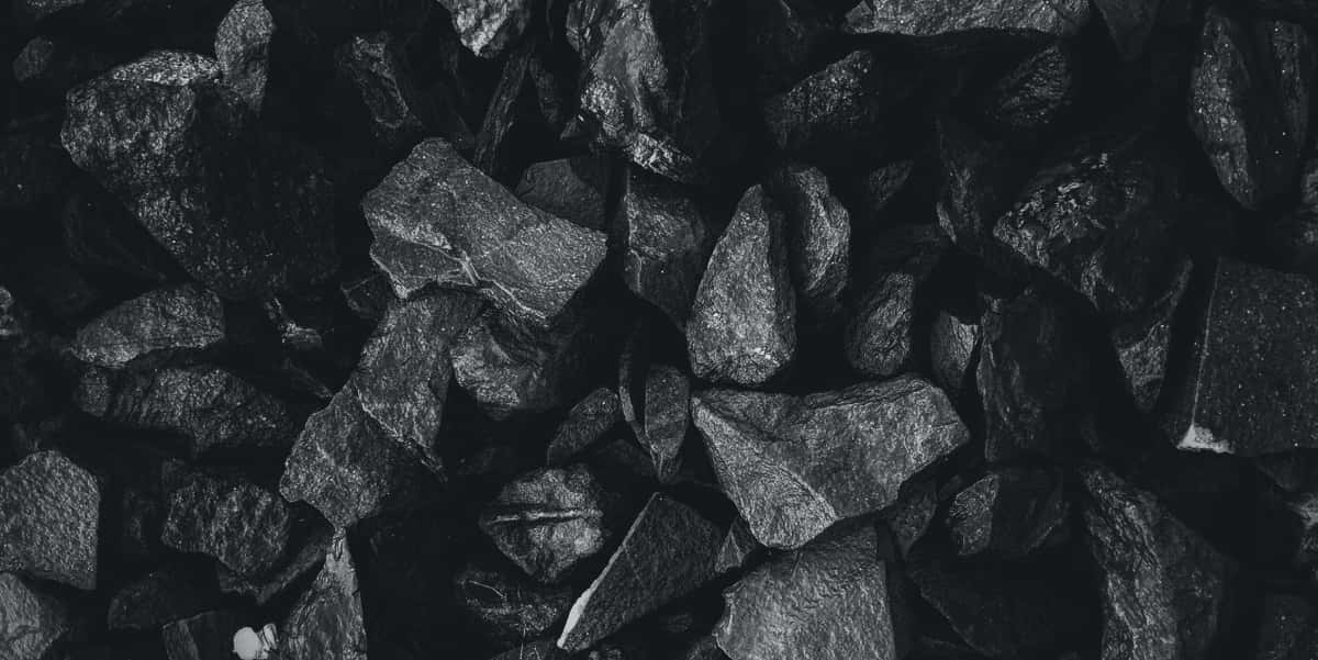 Black And White Photo Of A Pile Of Rocks Background