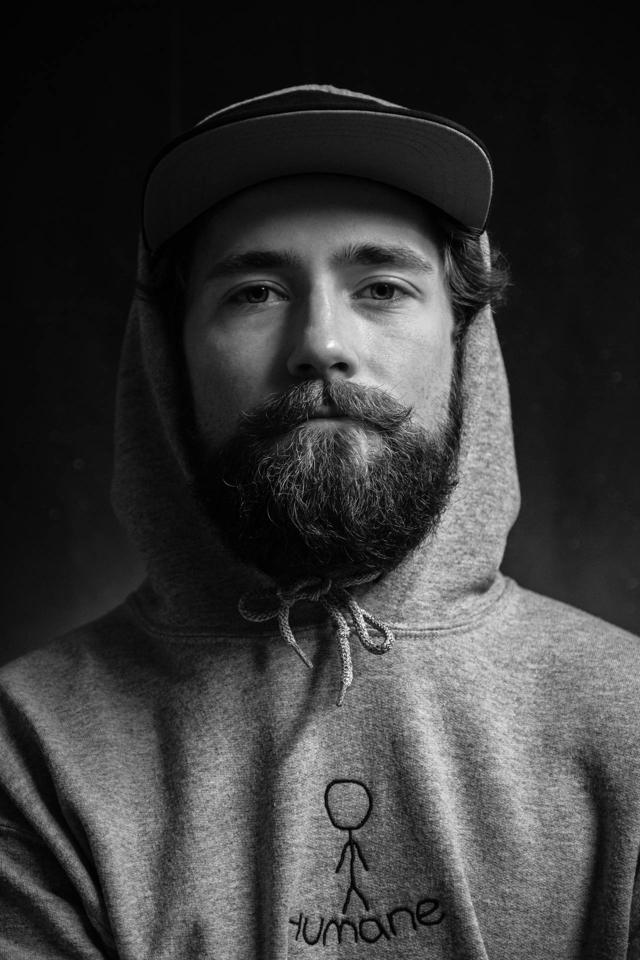 Black And White Portrait Of A Man With A Hoodie