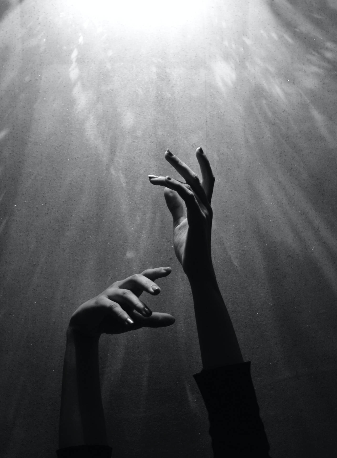 Black And White Portrait Of Hands Reaching For The Light Background