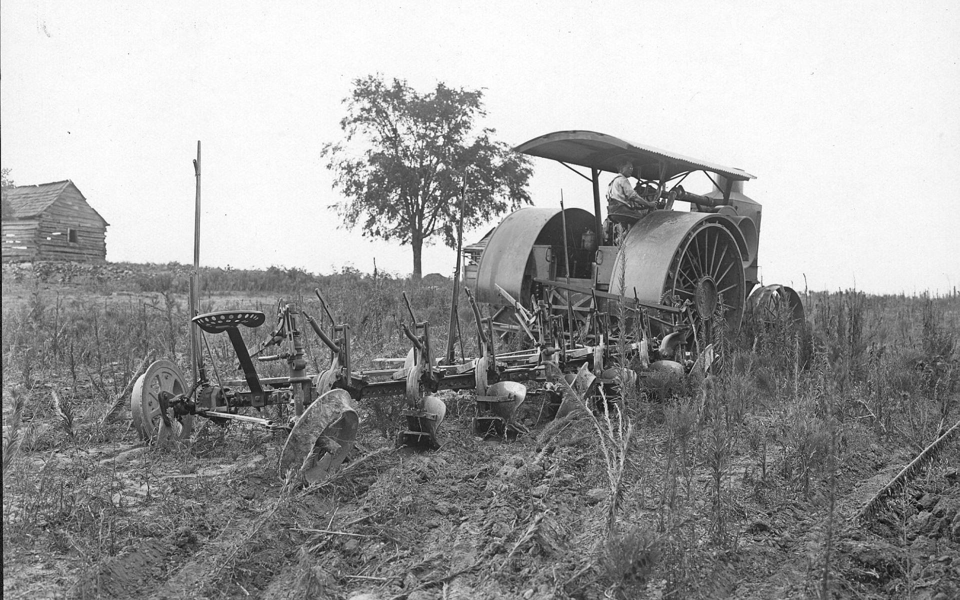 Black-and-white Vintage Tractor On The Field Background