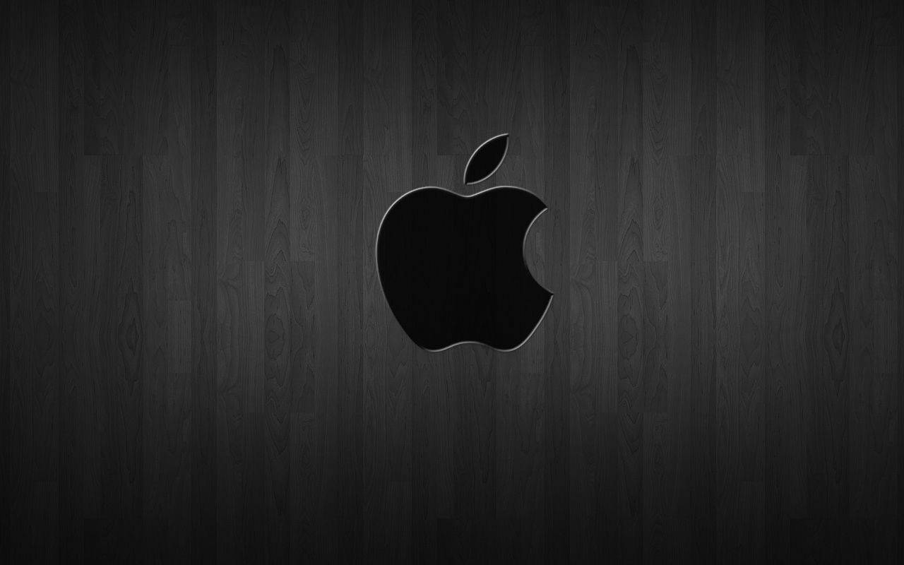 Black Apple Logo On Dark Wood Background