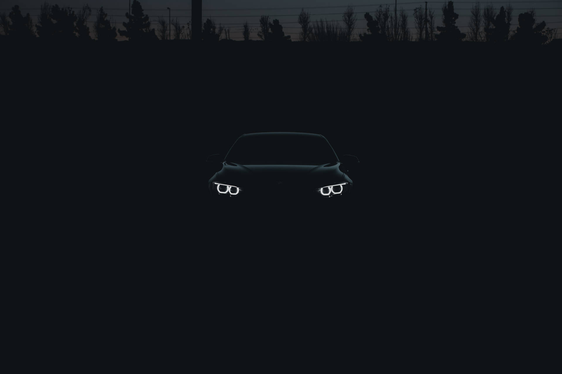 Black Bmw Car In The Shadows Background