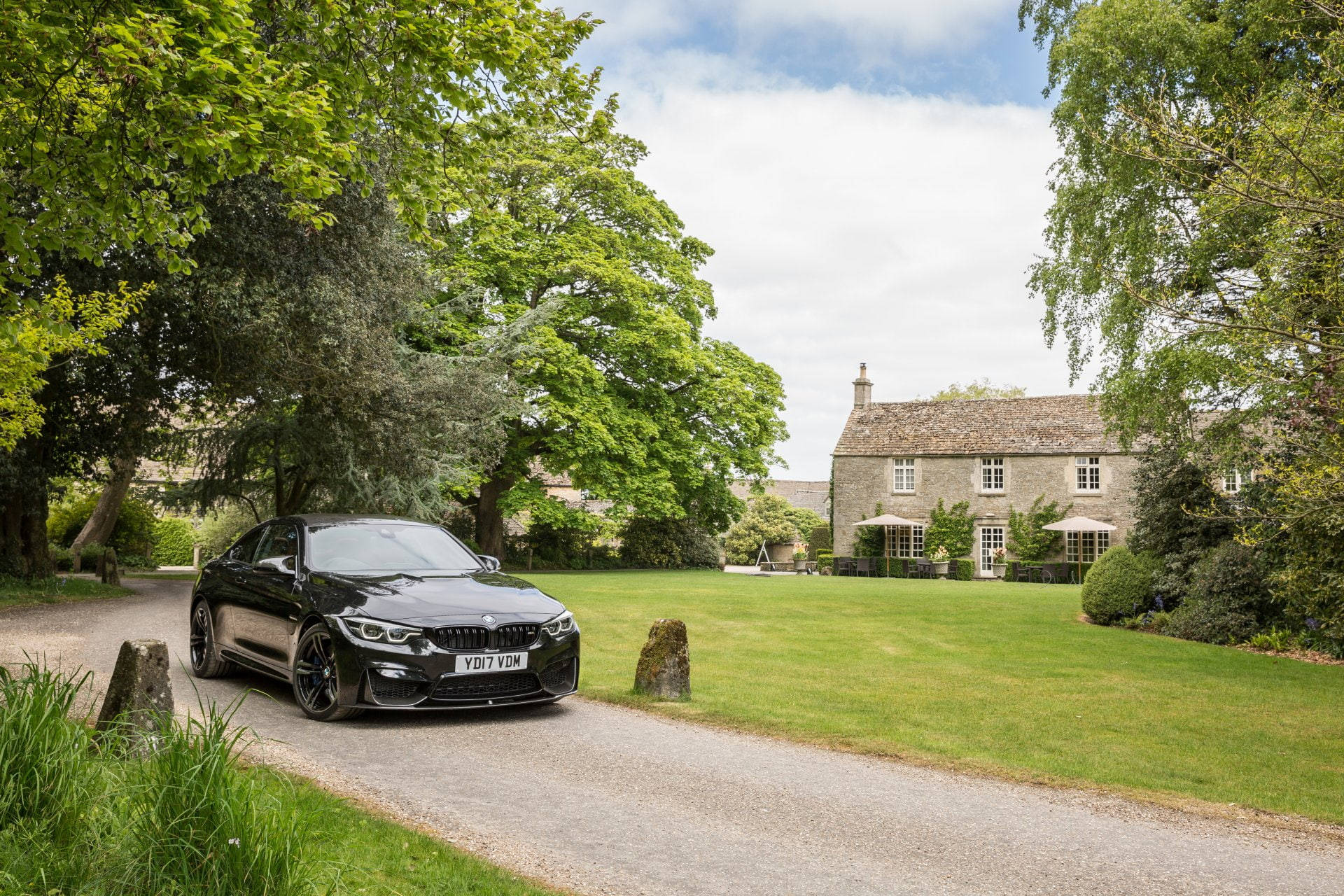 Black Bmw M4 And Country House Background