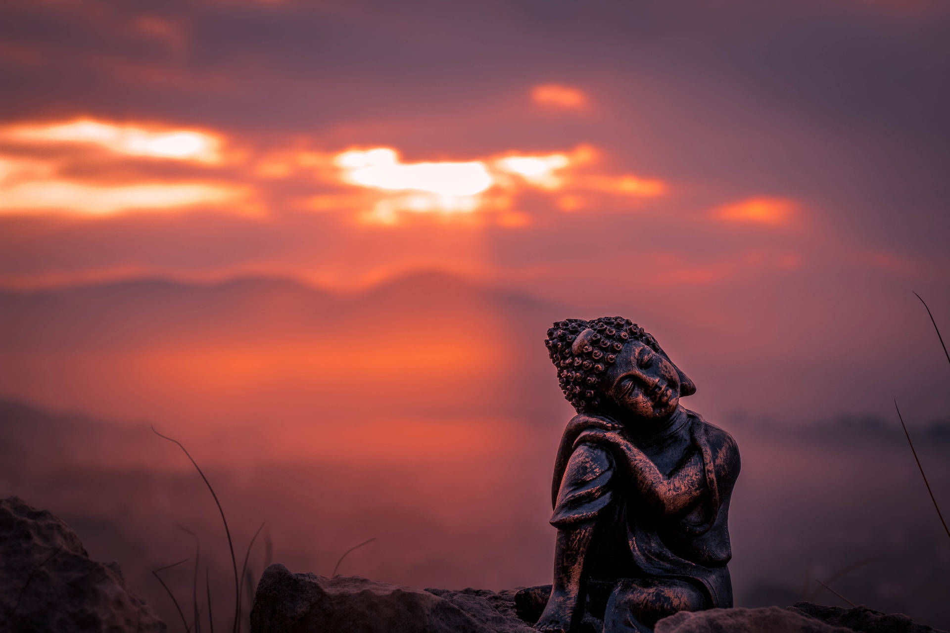 Black Buddha Orange Sky Background