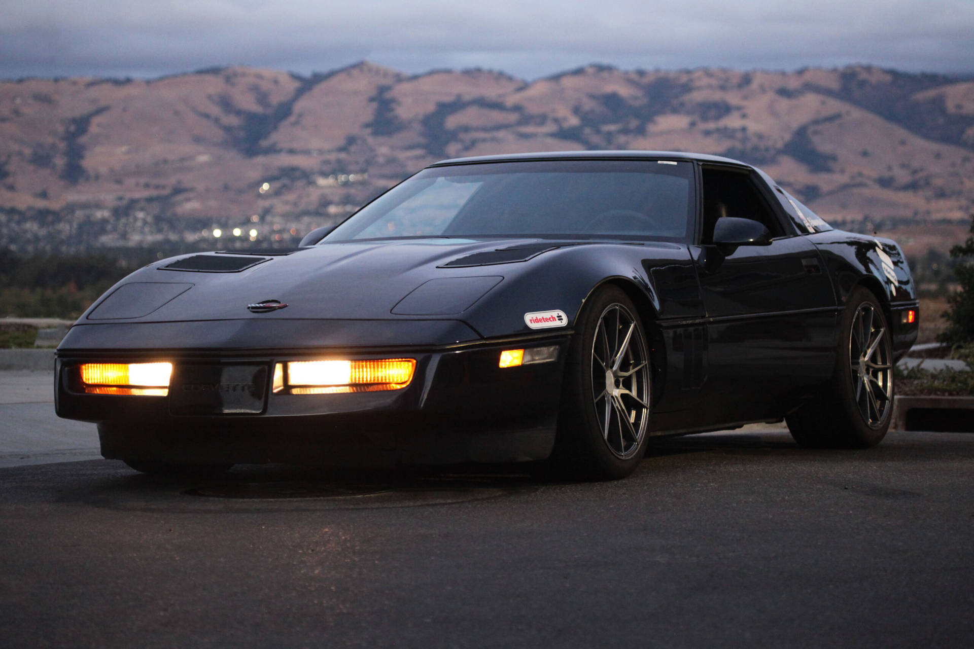 Black C4 Corvette In The Mountains Background