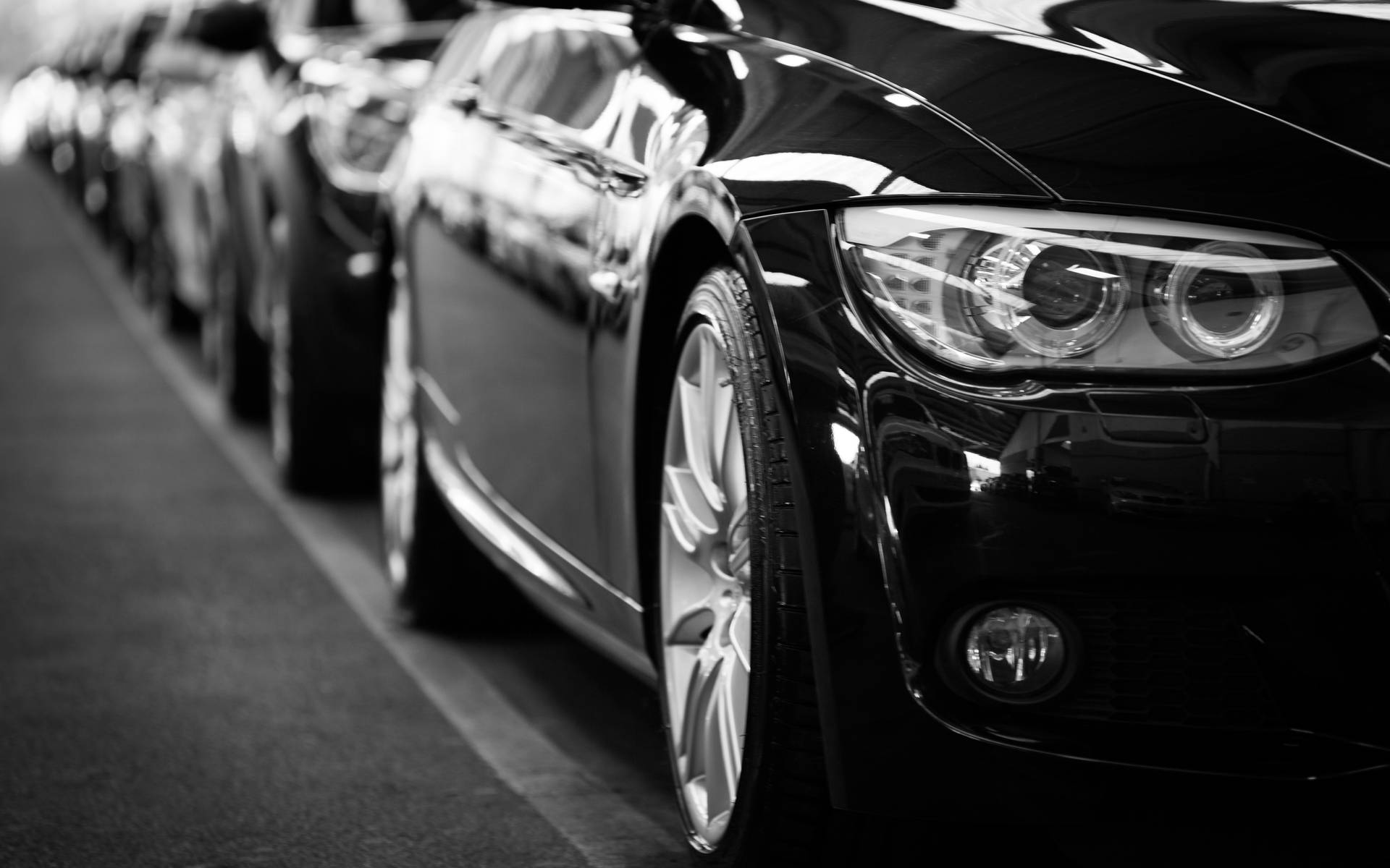 Black Cars Lined Up In Parking Space Background