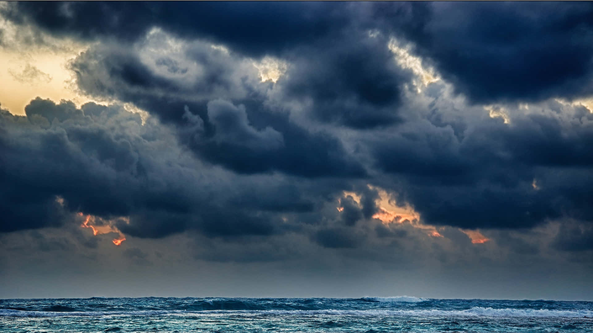 Black Clouds Above The Ocean Background