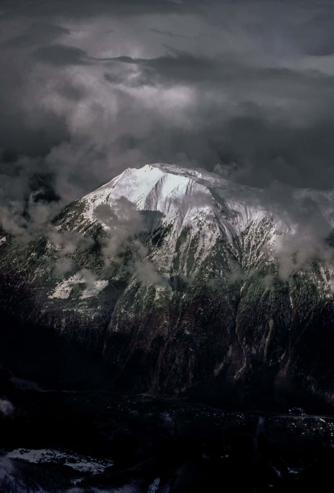 Black Clouds Shrouding The Mountain Background