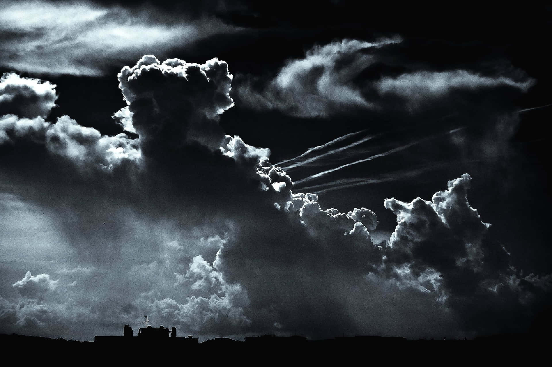 Black Clouds With Jet Trails Background