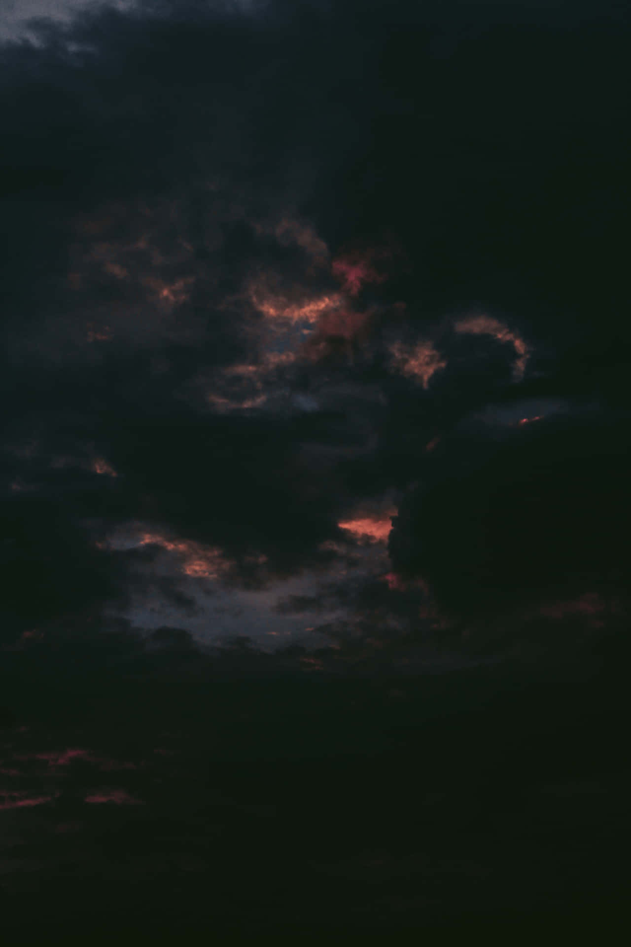 Black Clouds With Red Glow Background