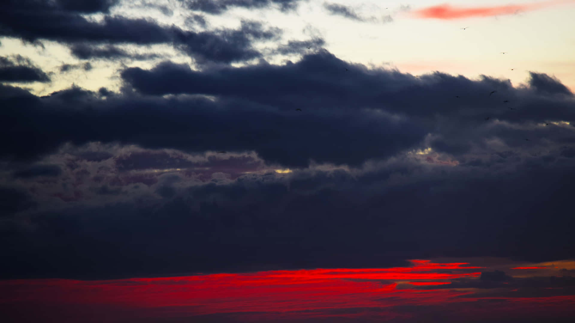 Black Clouds With Red Skies Background