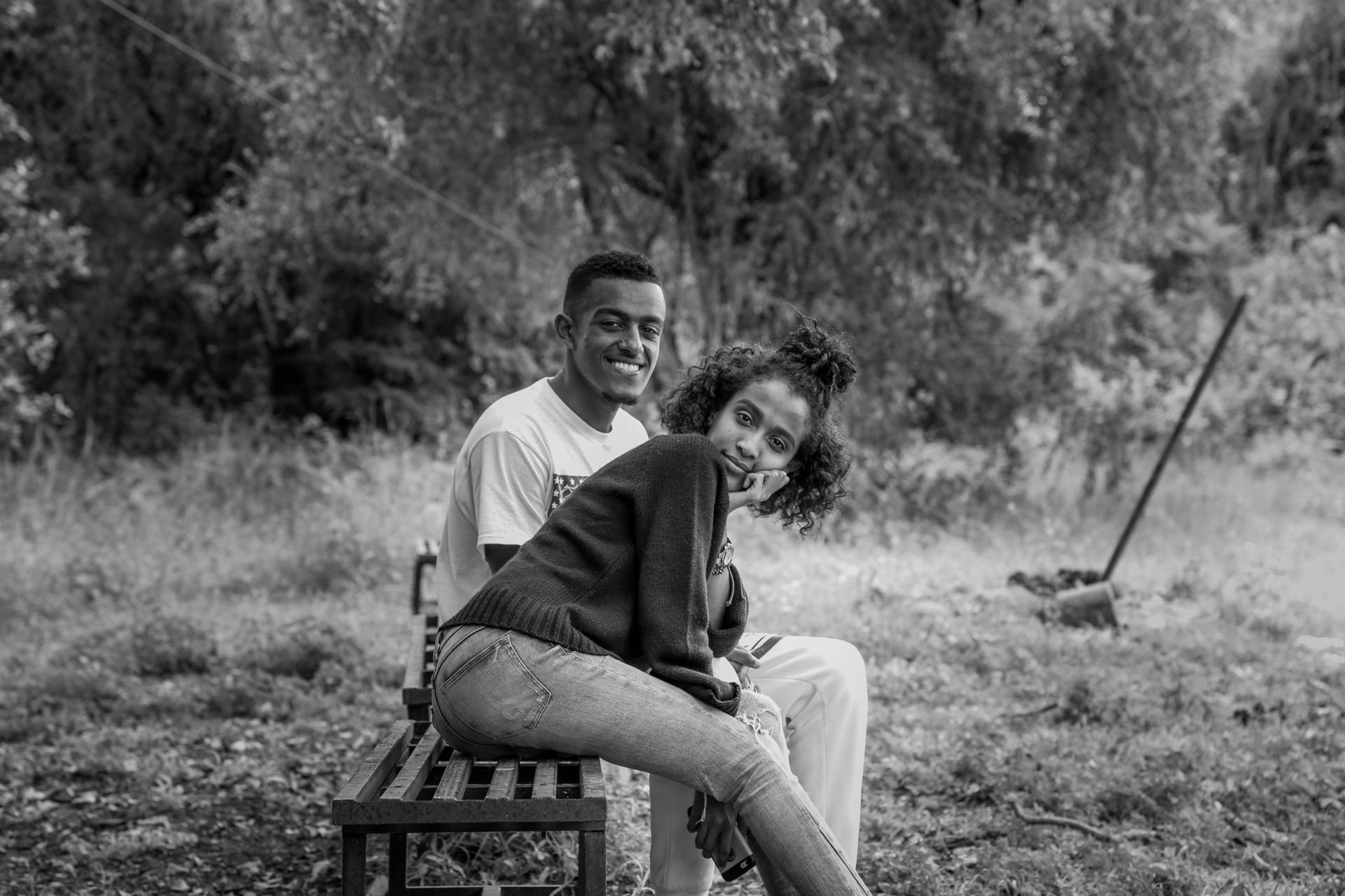 Black Couple On Bench Background