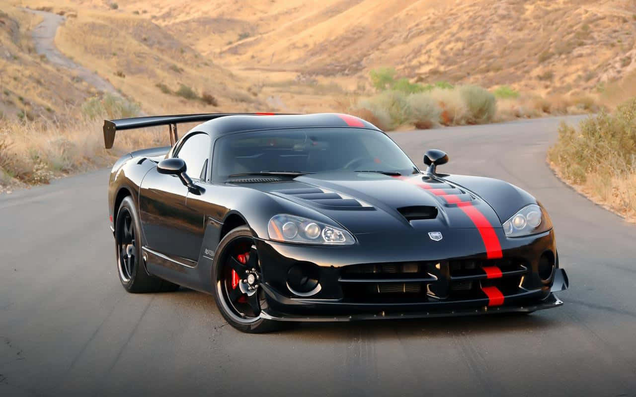 Black Dodge Viper With A Red Stripe Background