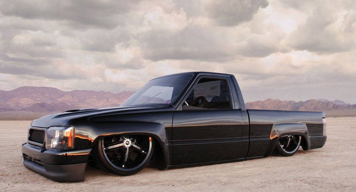 Black Dropped Truck On Sand