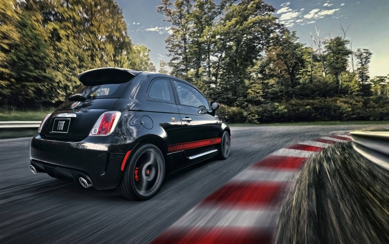 Black Fiat 500 Abarth In Motion Background