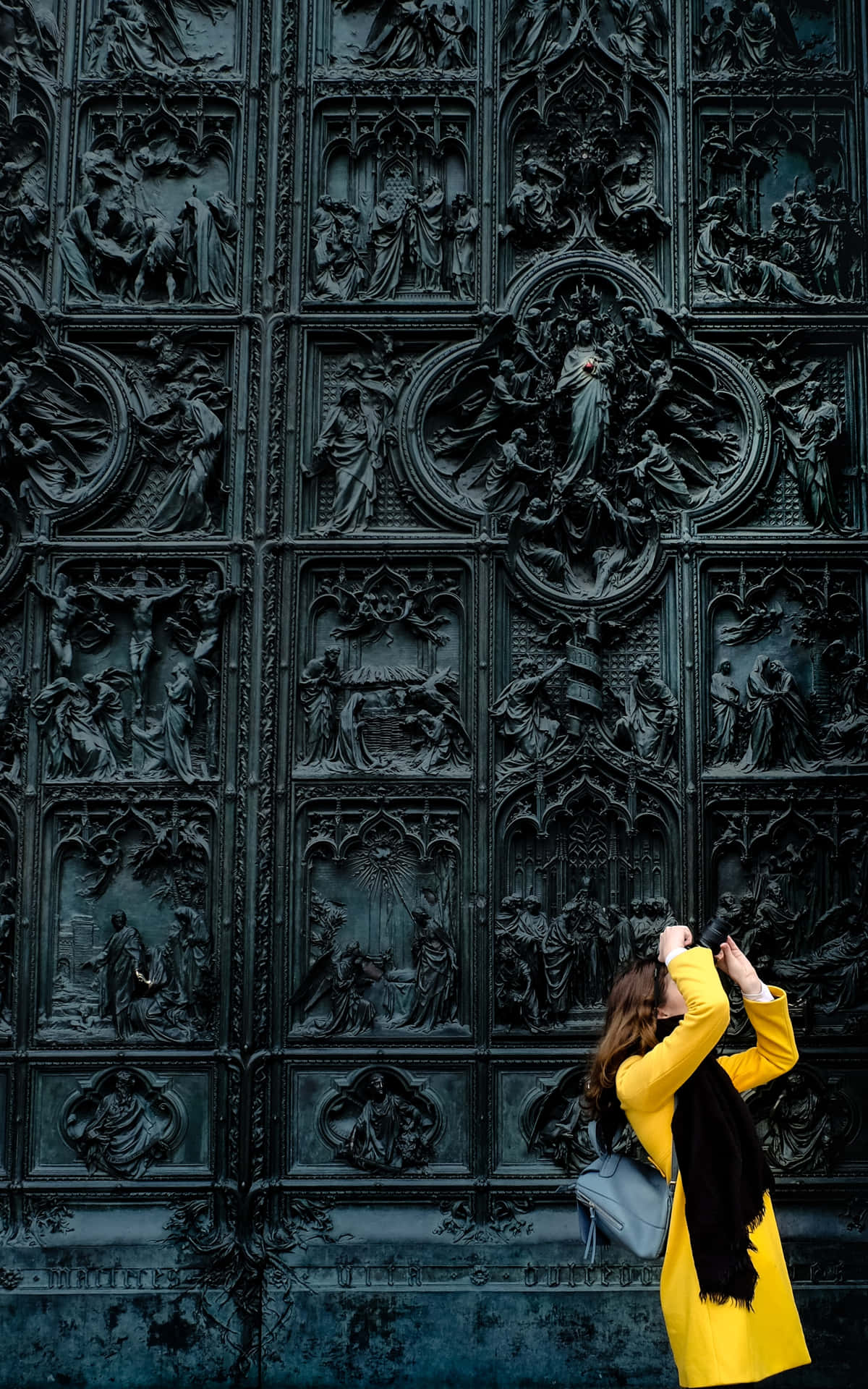Black Gate With A Conspicuous Woman In Yellow Background