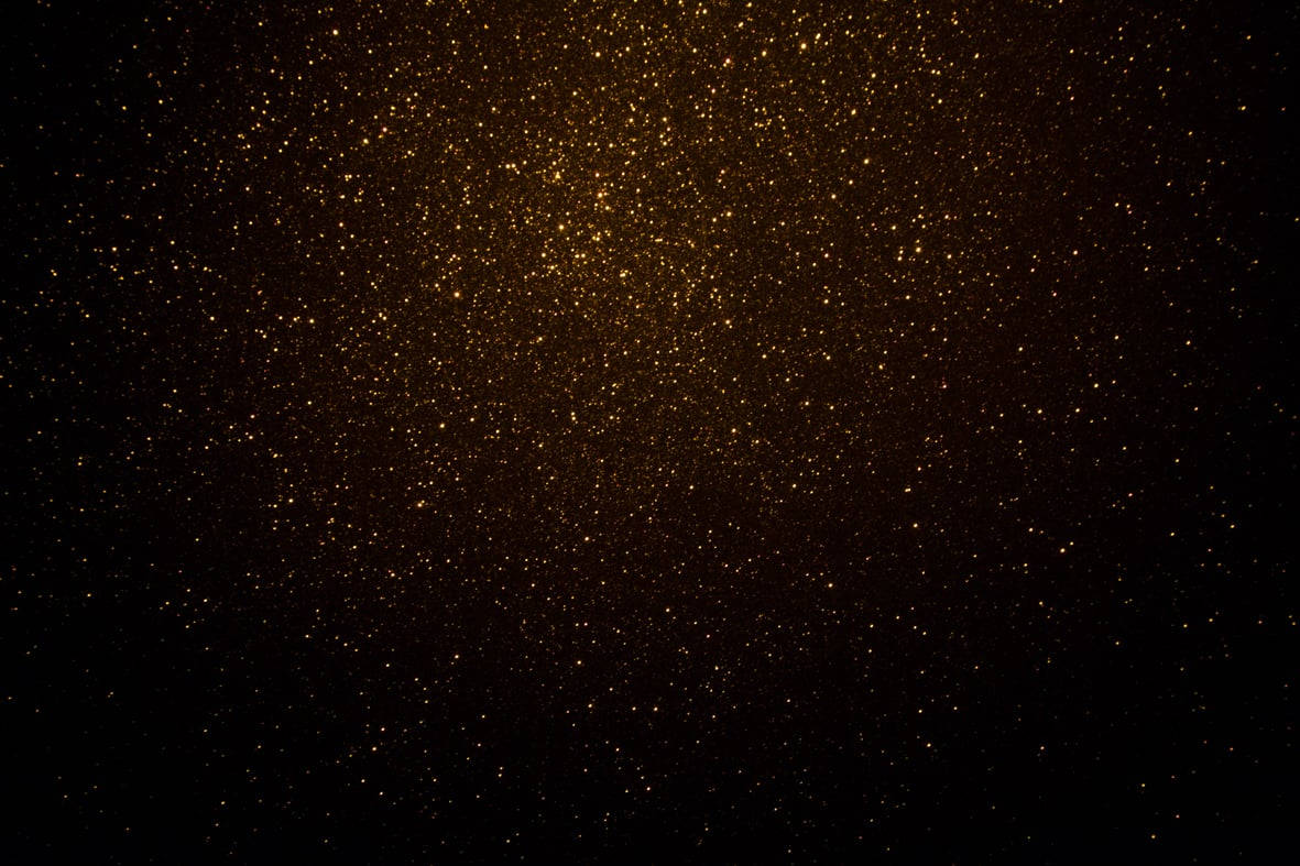 Black Glitter Trickling Gold Background